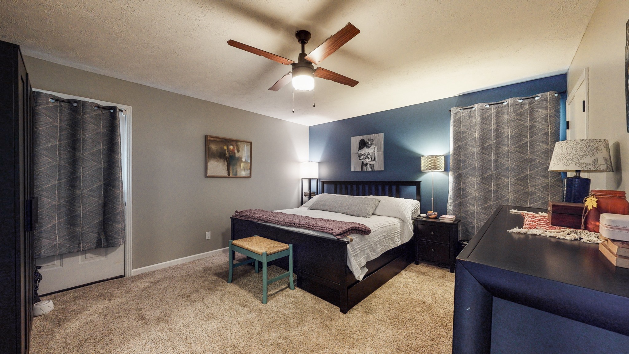 7306 Liberty Road Fairview, TN 37062 - Photo 14 of 19 a bedroom with a bed and a chandelier
