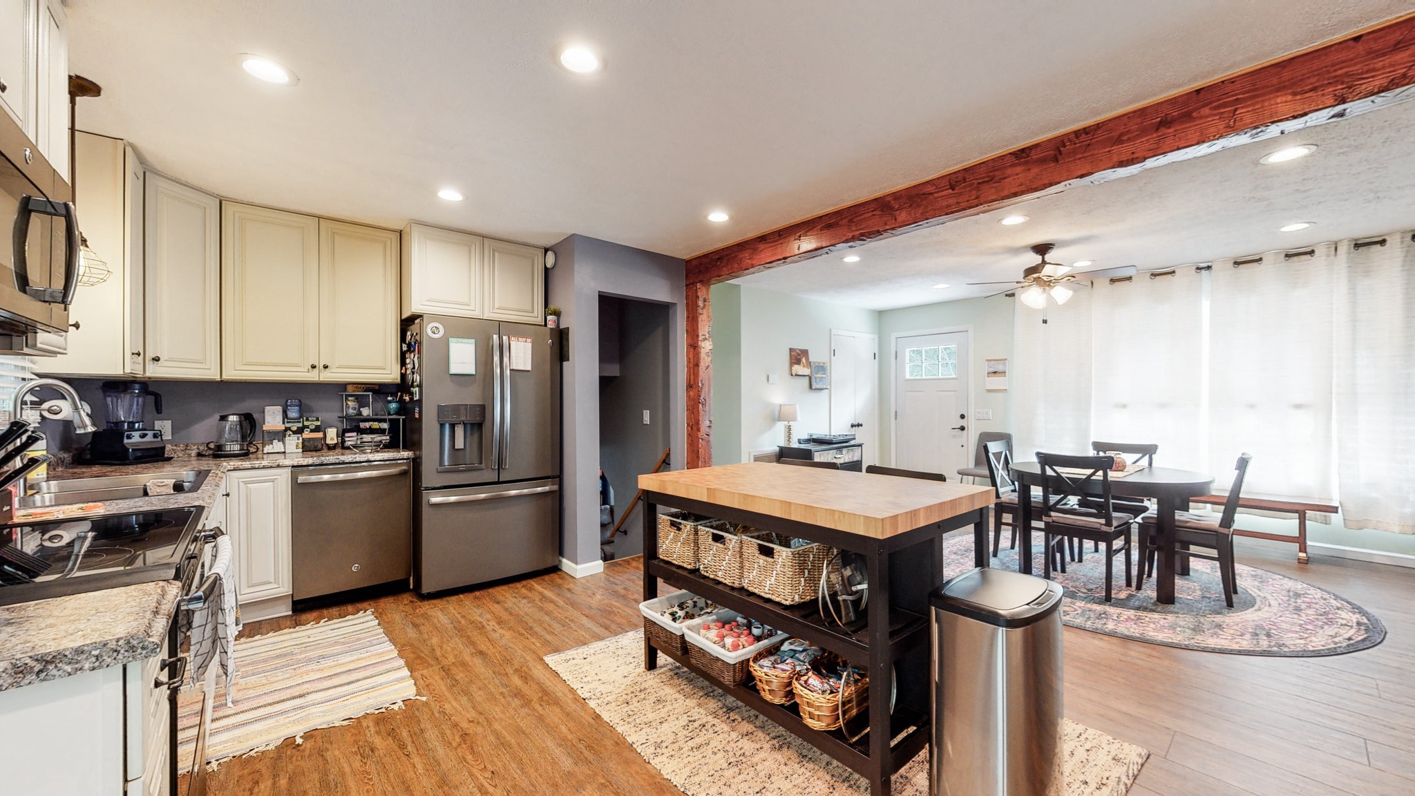 7306 Liberty Road Fairview, TN 37062 - Photo 10 of 19 a kitchen with a table chairs refrigerator and cabinets
