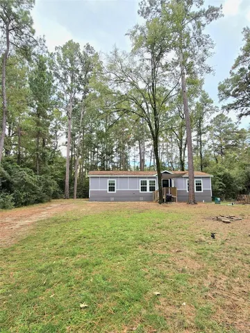 a house with trees in front of it