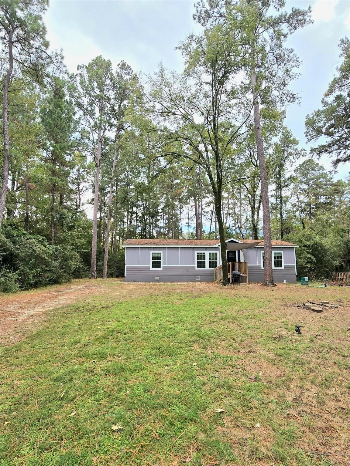 a house with trees in front of it