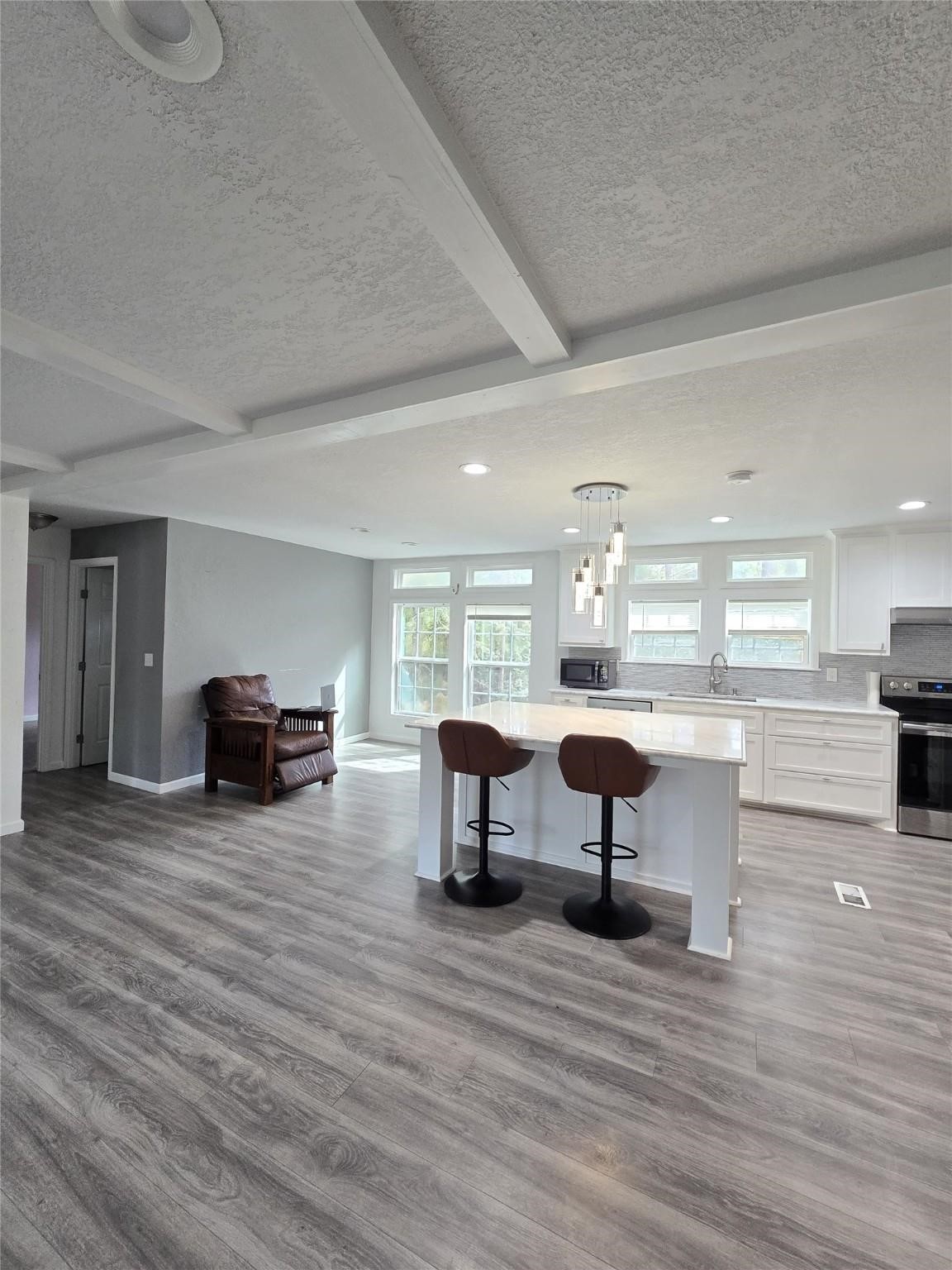 304 North Walnut Drive Trinity, TX 75862 - Photo 4 of 9 a living room with fireplace furniture and a wooden floor