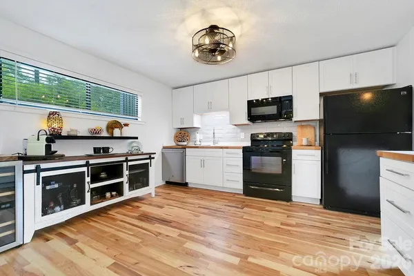 a kitchen with stainless steel appliances kitchen stove granite countertop a stove and a sink