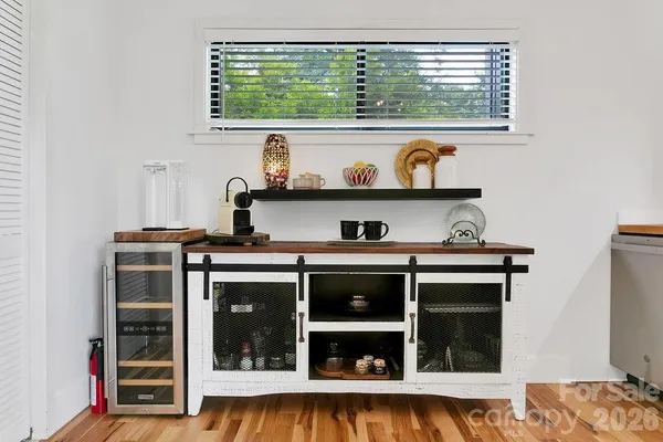 a kitchen with a stove and a window