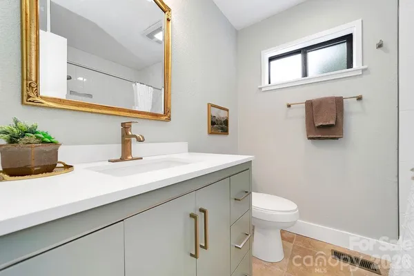 a bathroom with a sink and a toilet