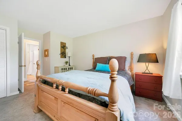 a bed room with a bed and a lamp