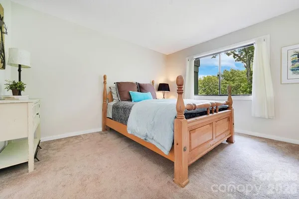 a bed room with bed and a window