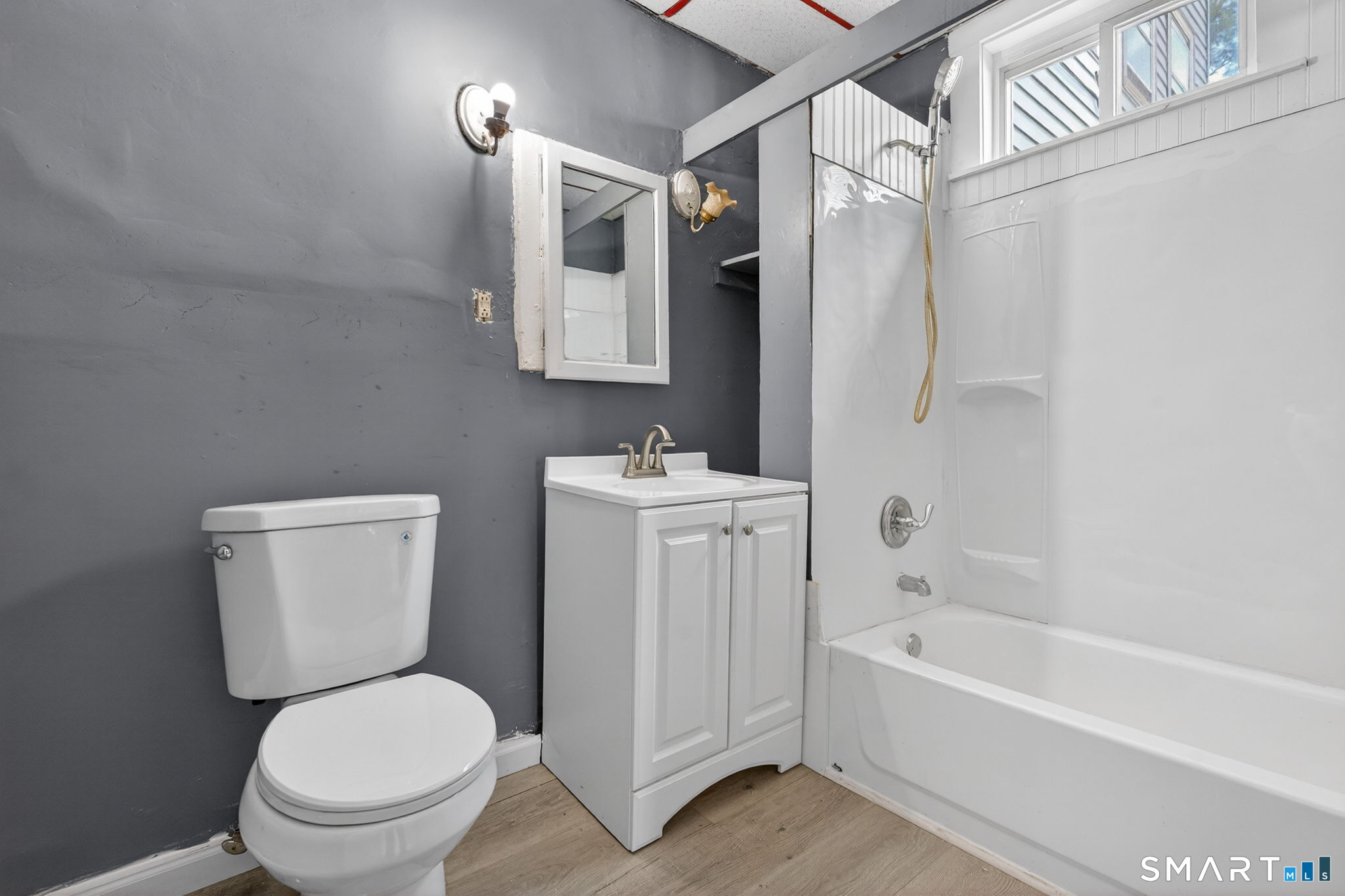 187 Whitney Street, Unit A2 Hartford, CT 06105 - Photo 15 of 17 a bathroom with a toilet sink and bathtub