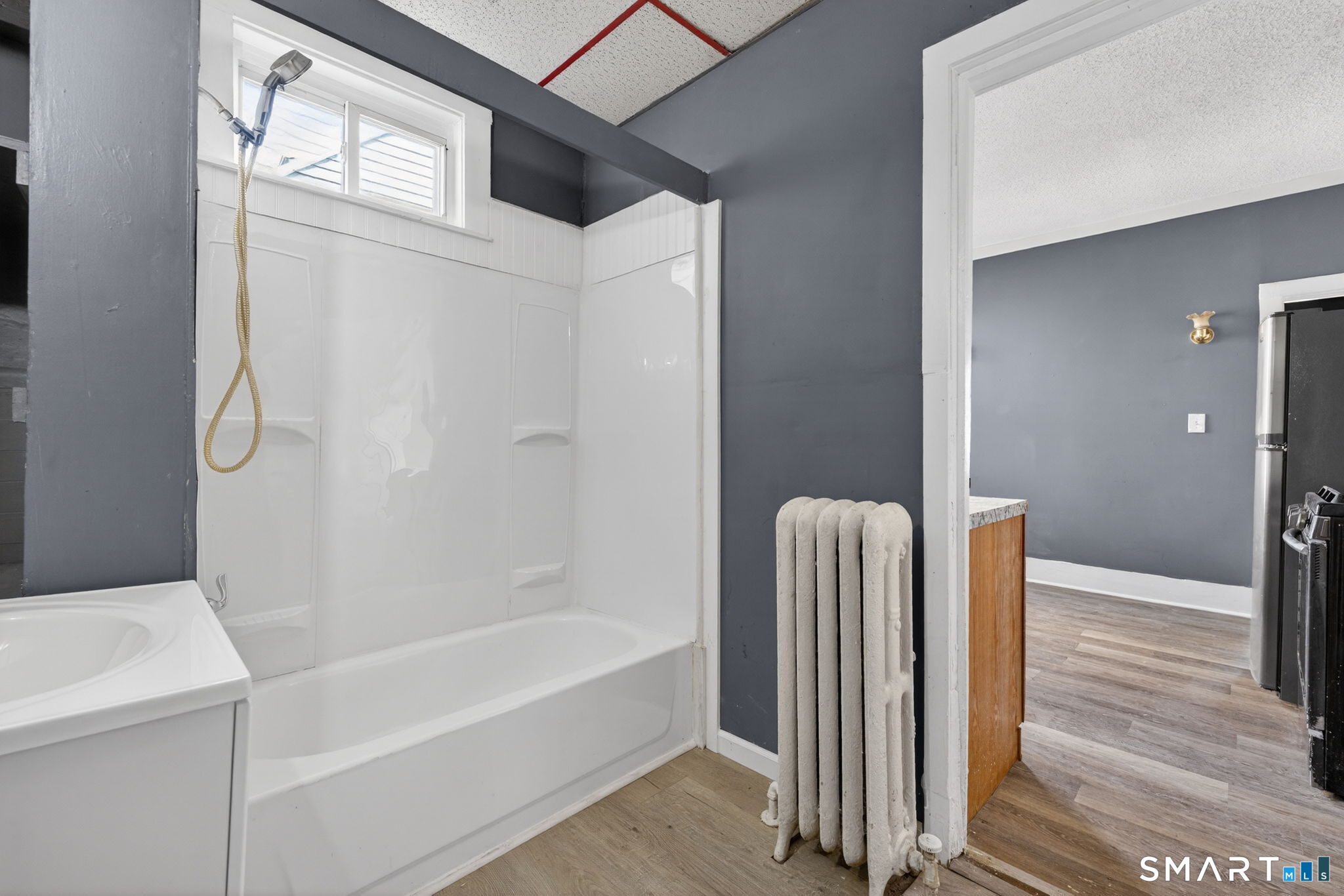 187 Whitney Street, Unit A2 Hartford, CT 06105 - Photo 16 of 17 a bathroom with a tub and shower