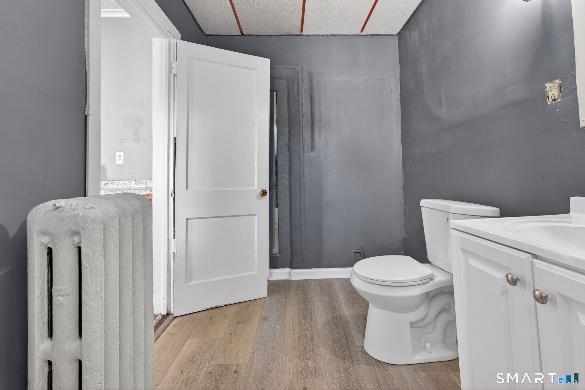 187 Whitney Street, Unit A2 Hartford, CT 06105 - Photo 17 of 17 a bathroom with a sink and a toilet