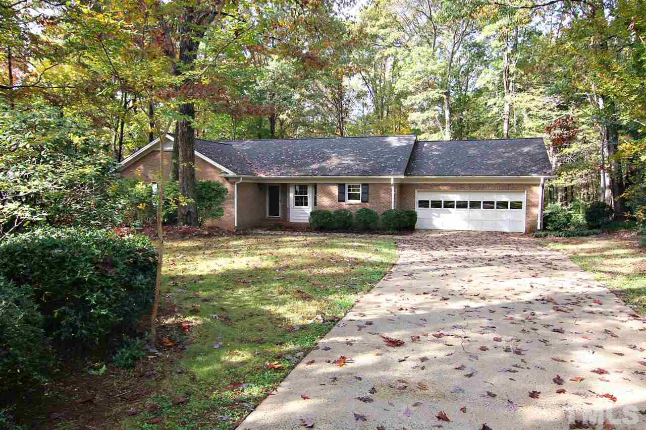 2816 Mattlyn Court Raleigh, NC 27613 - Photo 1 of 25 All Brick Ranch with Two Car Garage on an Incredible .92 Acre Private, Wooded Lot -- just One Mile from 540.