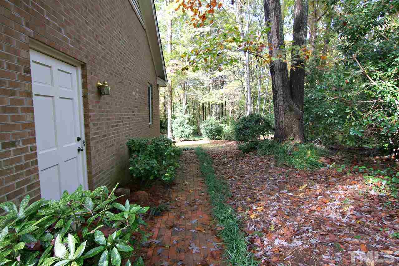 2816 Mattlyn Court Raleigh, NC 27613 - Photo 21 of 25 Brick Walk from Garage/Driveway to Backyard