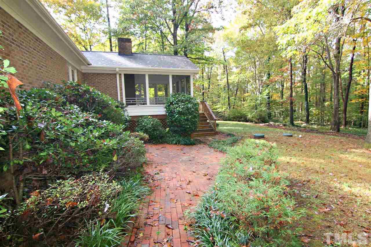2816 Mattlyn Court Raleigh, NC 27613 - Photo 5 of 25 Brick Walkway leads to the Screened Porch and Deck