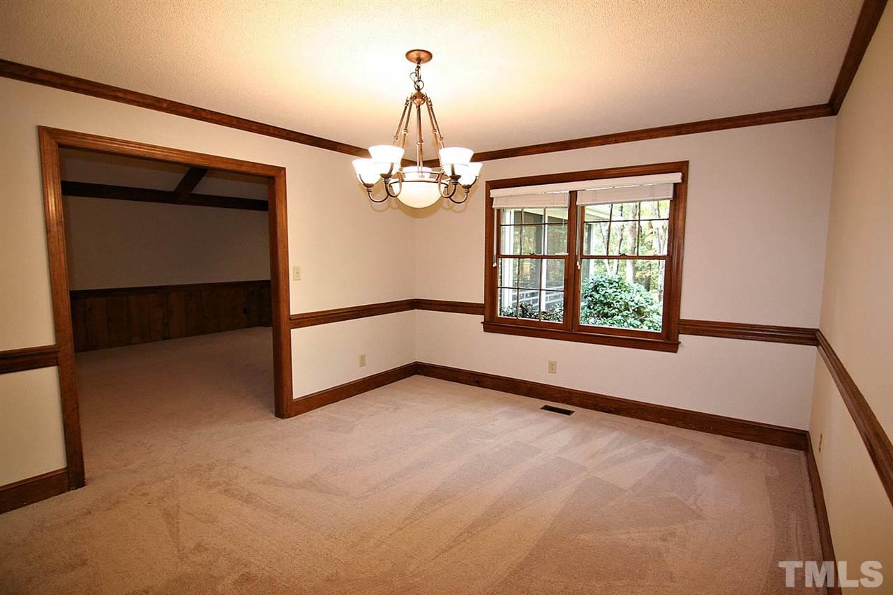 2816 Mattlyn Court Raleigh, NC 27613 - Photo 8 of 25 The Dining Space is a Joy for Casual or Formal Dinner Parties. Brand New Carpet and Paint. Notice the Chairrail and Crown Molding.