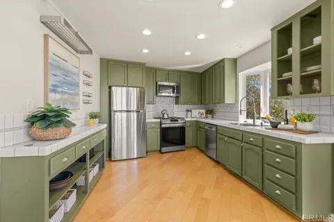 a kitchen with a sink and cabinets