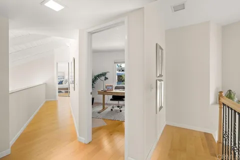 a view of a chair and table in the balcony