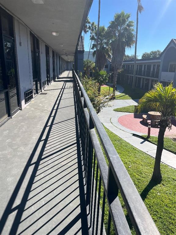 8421 South Orange Blossom Trail, Unit 254 Orlando, FL 32809 - Photo 2 of 13 a view of swimming pool with a patio and a yard