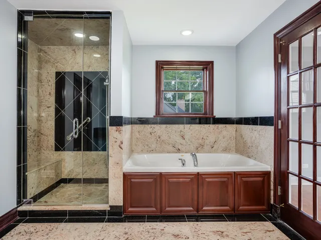 a bathroom with a tub and a sink
