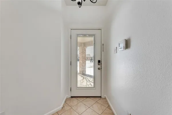 a view of an empty room and window