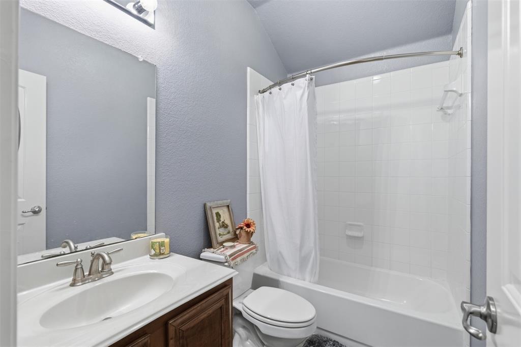 5491 Exeter Drive Prosper, TX 75078 - Photo 15 of 20 a bathroom with a sink toilet and shower