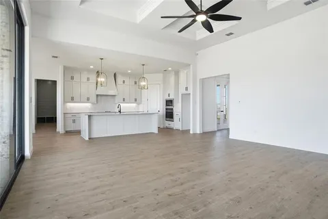 a view of a kitchen with a sink and cabinet