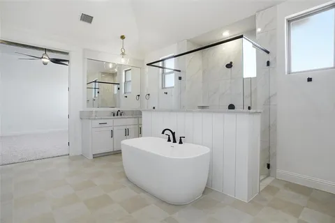 a bathroom with a sink a mirror and shower