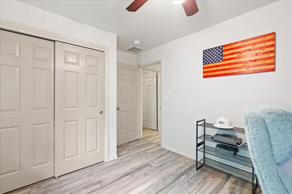 a workspace room with furniture and wooden floor