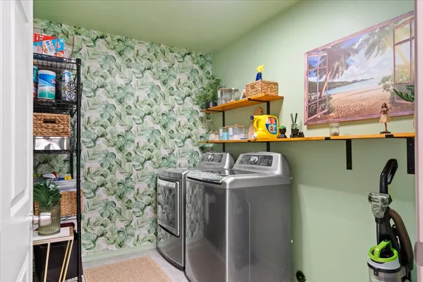 a utility room with dryer and washer
