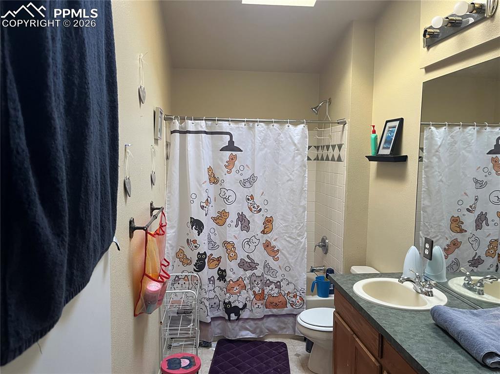7860 Gladwater Road Peyton, CO 80831 - Photo 17 of 22 a bathroom with a sink toilet and shower