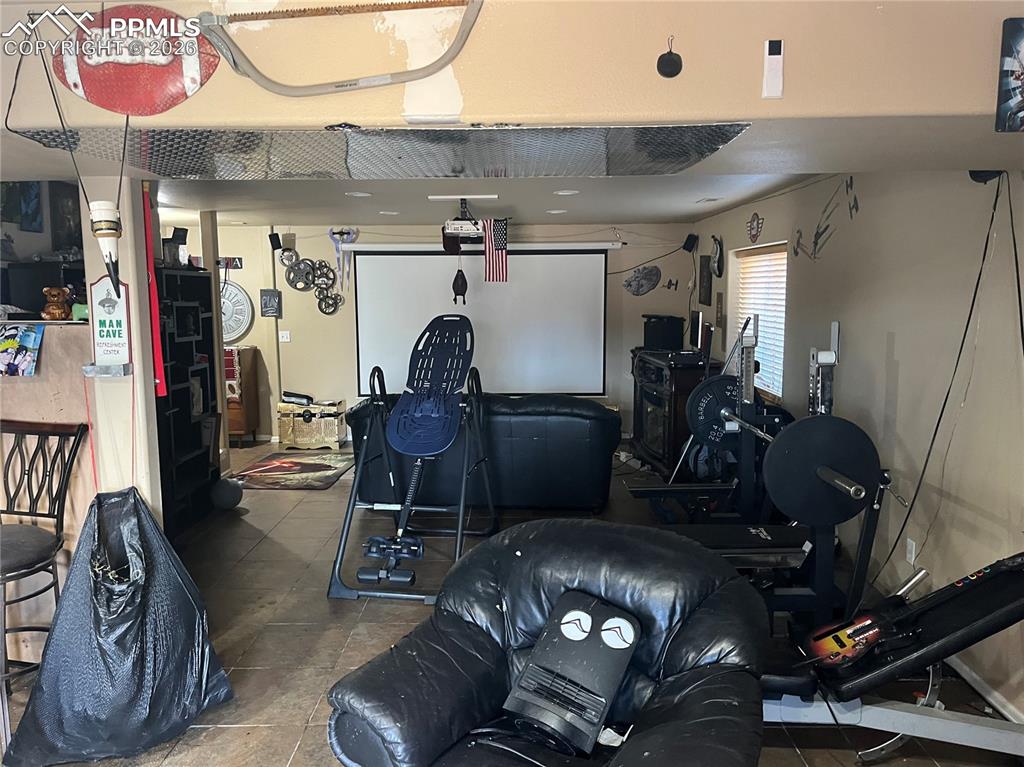 7860 Gladwater Road Peyton, CO 80831 - Photo 22 of 22 a room with gym equipment