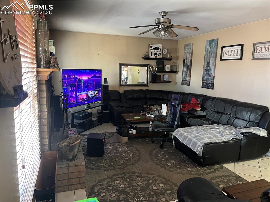 7860 Gladwater Road Peyton, CO 80831 - Photo 10 of 22 a bedroom with furniture and a flat screen tv