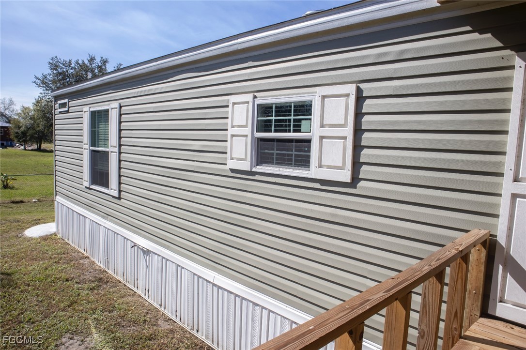 720 North Estribo Street Clewiston, FL 33440 - Photo 18 of 39 a view of a house with a large window