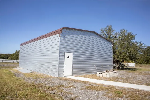 a backyard of a house with garage