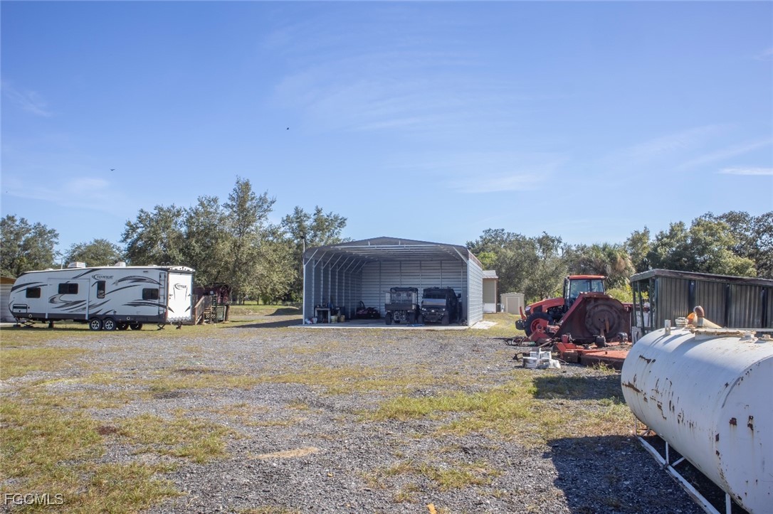 720 North Estribo Street Clewiston, FL 33440 - Photo 23 of 39 a view of a couches in front of a house