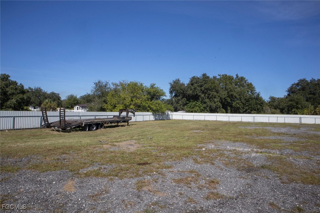 720 North Estribo Street Clewiston, FL 33440 - Photo 24 of 39 a view of a field with trees in the background