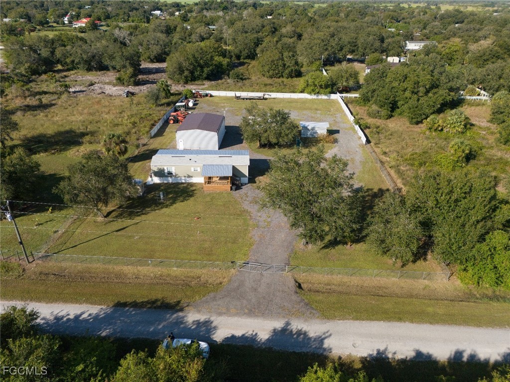 720 North Estribo Street Clewiston, FL 33440 - Photo 26 of 39 an aerial view of residential houses with outdoor space