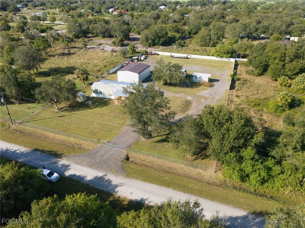 720 North Estribo Street Clewiston, FL 33440 - Photo 27 of 39 an aerial view of residential houses with outdoor space
