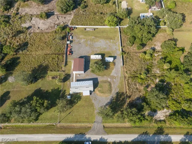 aerial view of a house with a yard