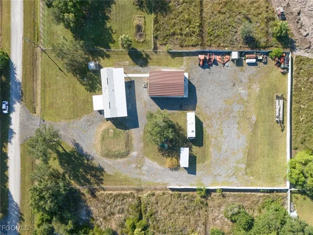 aerial view of a house with a yard