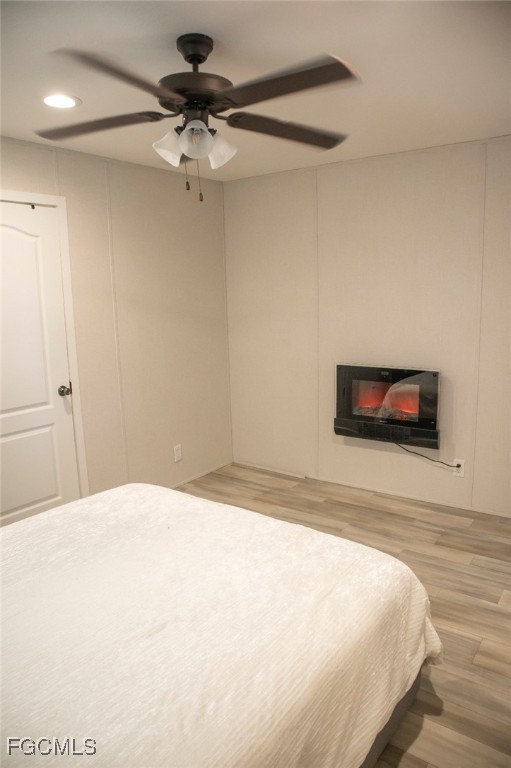 720 North Estribo Street Clewiston, FL 33440 - Photo 10 of 39 a bedroom with a bed and a chandelier