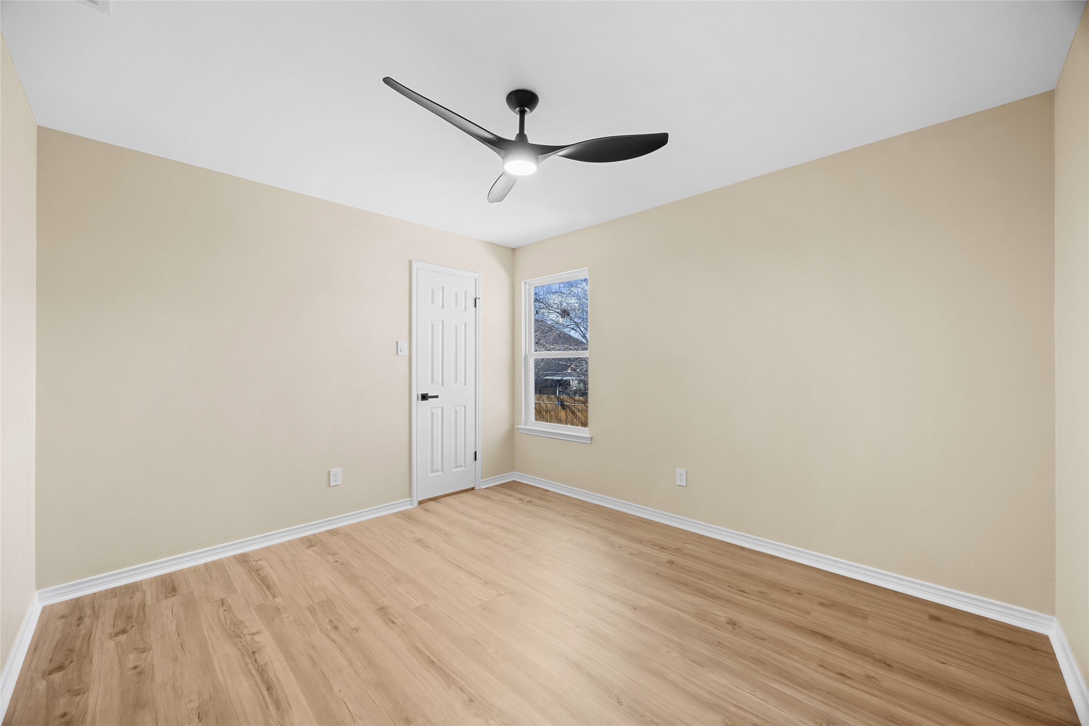 1002 Crestview Street Round Rock, TX 78681 - Photo 35 of 40 Empty room featuring light wood finished floors and a ceiling fan