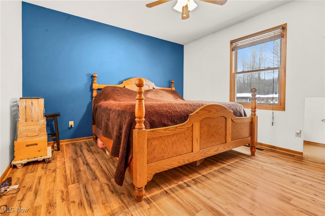 1648 Cassell Road Butler, OH 44822 - Photo 6 of 36 Bedroom with hardwood / wood-style flooring and ceiling fan
