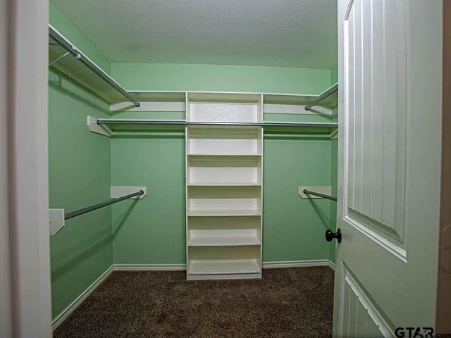 a spacious bathroom with a double vanity sink double and mirror