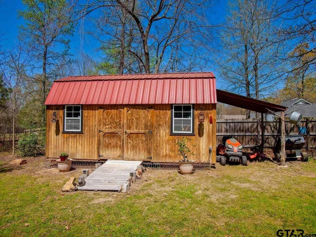 a view of a park with large trees