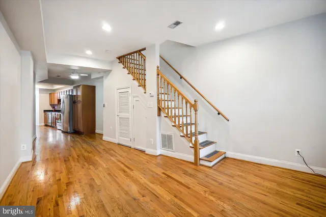 a view of entryway with wooden floor