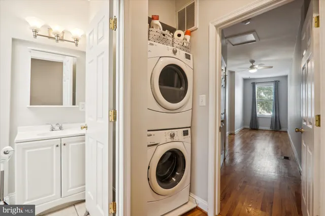a view of a hallway with washer and dryer