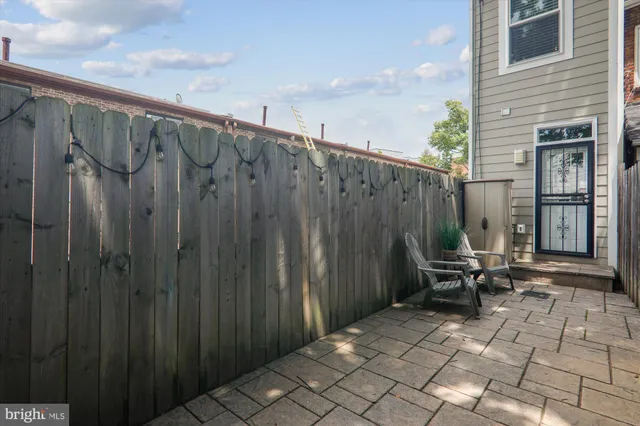 a view of outdoor space with wooden floor and seating