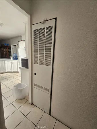 a bed sitting in a room next to a window