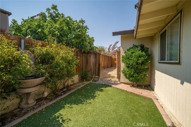 a backyard of a house with lots of green space
