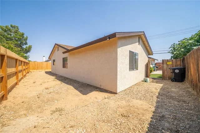 a view of a house with a snow on the road