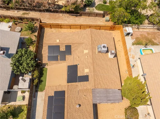 aerial view of a house with a yard